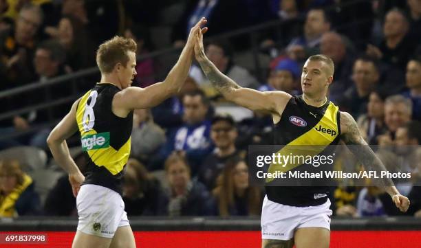 Jack Riewoldt and Dustin Martin of the Tigers celebrate during the 2017 AFL round 11 match between the North Melbourne Kangaroos and the Richmond...