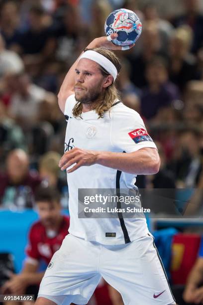 Mikkel Hansen of Paris trhows the ball during the VELUX EHF FINAL4 Semi Final match between Telekom Veszprem and Paris Saint-Germain Handball at...