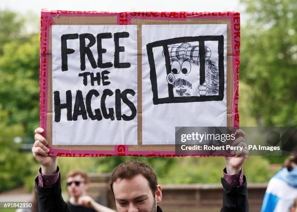 Man holds a banner saying &quot;Free the haggis&quot; as he takes part in the March for Independence through Glasgow city centre.