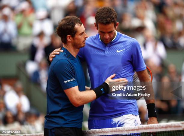 Andy Murray of Great Britain and Juan Martin Del Potro of Argentina embrace after the men's singles third round match during day seven of the French...