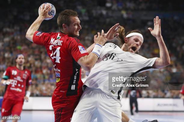 Gaspar Marguc vv is challenged by Mikkel Hansen of Paris during the VELUX EHF FINAL4 Semi Final between Telekom Veszprem and Paris Saint-Germain...