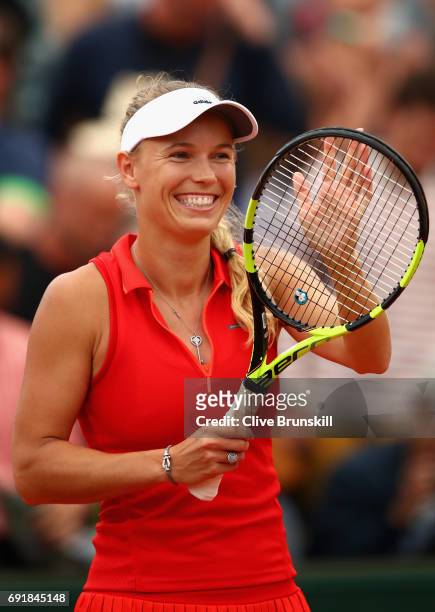 Carolina Wozniacki of Denmark celebrates victory following the ladies singles third round match against Catherine Bellis of The United States on day...