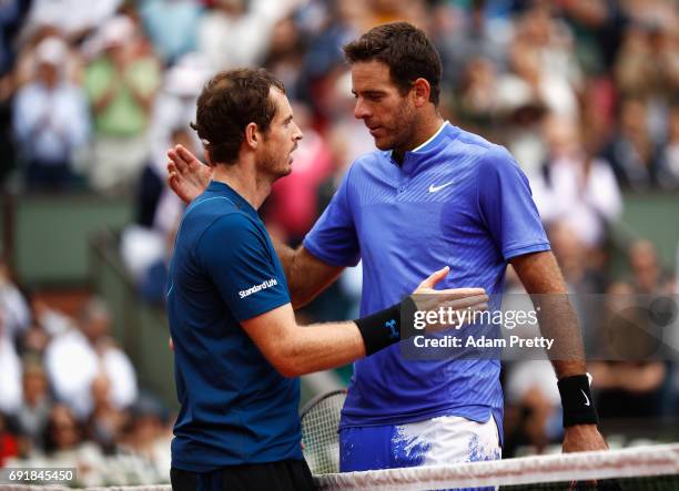 Andy Murray of Great Britain and Juan Martin Del Potro of Argentina embrace after the men's singles third round match during day seven of the French...