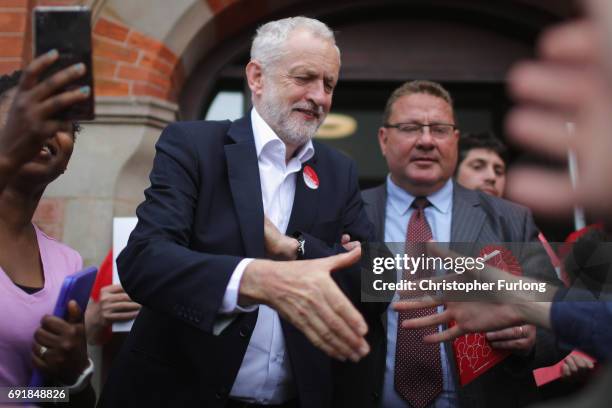 Labour leader Jeremy Corbyn shakes hands with supporters at a rally at Hucknall Market Place as he visits the East Midlands during the final weekend...