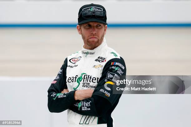 Blake Koch, driver of the LeafFilter Gutter Protection Chevrolet, stands on the grid during qualifying for the NASCAR XFINITY Series OneMain...