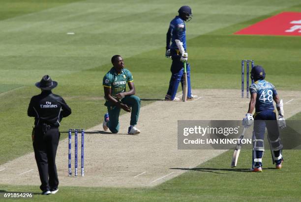 South Africas Kagiso Rabada reacts after he dropped a catch and failed to dismiss Sri Lankas Upul Tharanga whilst bowling during the ICC Champions...