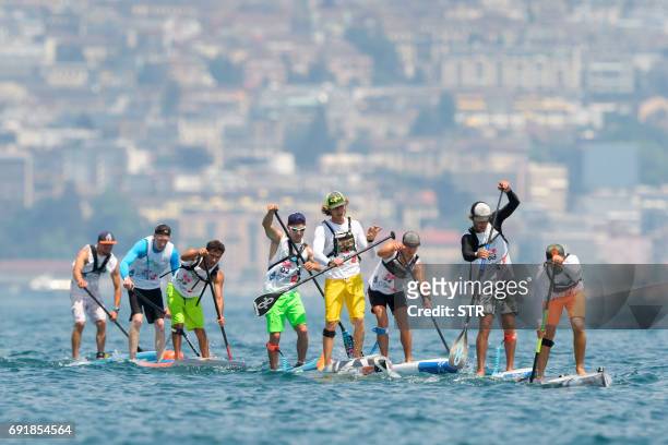 Athletes competes during the Thonon Sup Race, a 19km race crossing Lake Geneva between Lausanne, Switzerland and Thonon-les-bains, France, during...