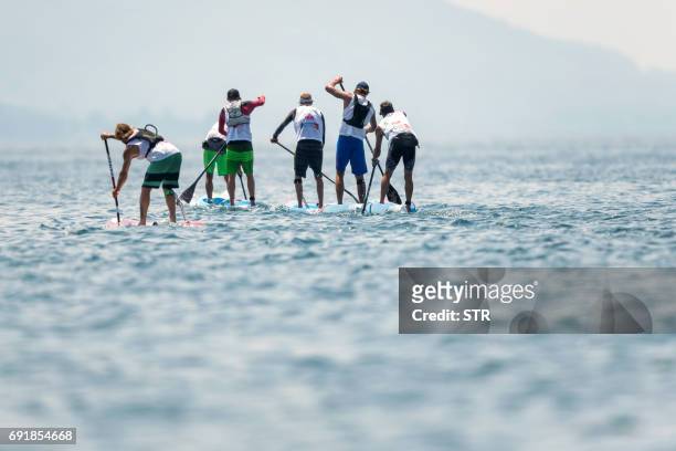 Athletes compete during the Thonon Sup Race, a 19km race crossing Lake Geneva between Lausanne, Switzerland and Thonon-les-bains, France, during week...