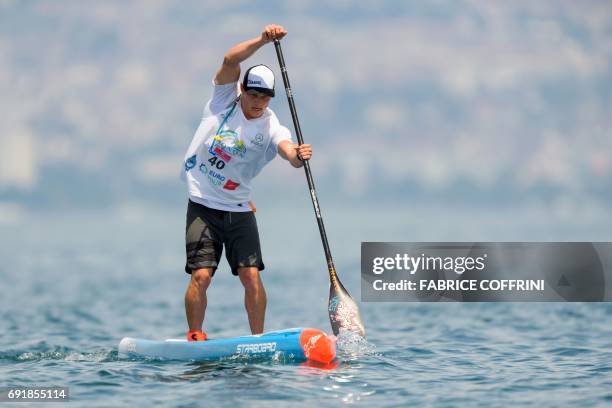 Australia's Michael Booth competes to win the Thonon Sup Race, a 19km race crossing Lake Geneva between Lausanne, Switzerland and Thonon-les-bains,...