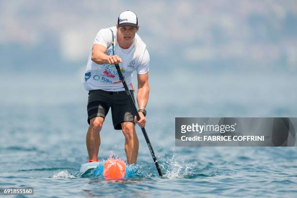 Australia's Michael Booth competes to win the Thonon Sup Race, a 19km race crossing Lake Geneva between Lausanne, Switzerland and Thonon-les-bains,...