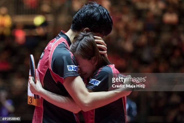 Maharu Yoshimura of Japan and Kasumi Ishikawa hug each other after winning Mixed Doubles Finals at Table Tennis World Championship at Messe...