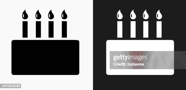 birthday cake icon on black and white vector backgrounds - birthday candles stock illustrations