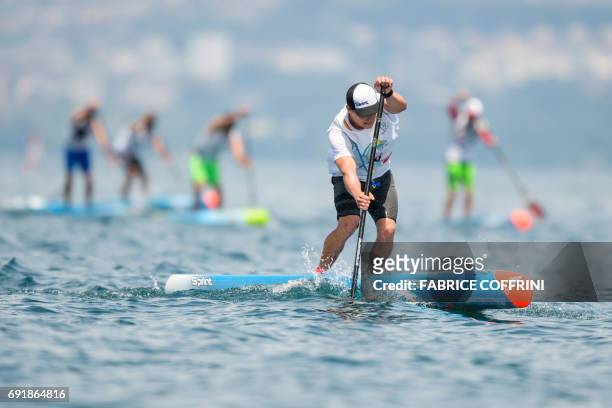 Australia's Michael Booth competes to win the Thonon Sup Race, a 19km race crossing Lake Geneva between Lausanne, Switzerland and Thonon-les-bains,...