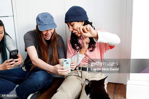 girl friends hanging out together - one in three people stock pictures, royalty-free photos & images