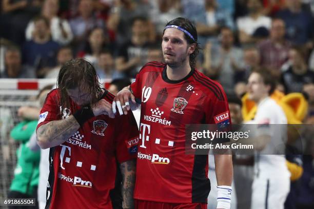 Laszlo Nagy and Andreas Nilsson of Veszprem react after the VELUX EHF FINAL4 Semi Final between Telekom Veszprem and Paris Saint-Germain Handball at...