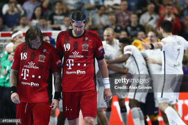 Laszlo Nagy and Andreas Nilsson of Veszprem react after the VELUX EHF FINAL4 Semi Final between Telekom Veszprem and Paris Saint-Germain Handball at...