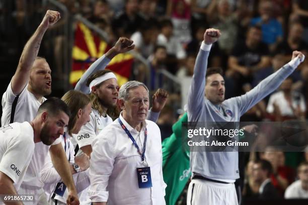 The Paris bench celebrates a goal during the VELUX EHF FINAL4 Semi Final between Telekom Veszprem and Paris Saint-Germain Handball at Lanxess Arena...