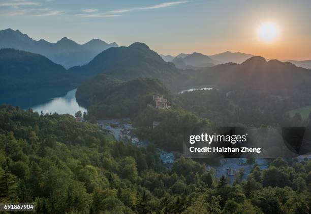 lake called alpsee and the hohenschwangau castle in bavaria - lake alpsee stock pictures, royalty-free photos & images