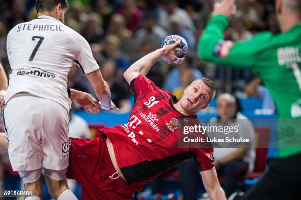 Blaz Blagotinsek of Veszprem throws the ball during the VELUX EHF FINAL4 Semi Final match between Telekom Veszprem and Paris Saint-Germain Handball...