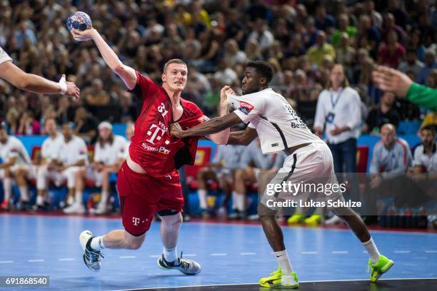 Blaz Blagotinsek of Veszprem is attacked by Luc Abalo of Paris during the VELUX EHF FINAL4 Semi Final match between Telekom Veszprem and Paris...