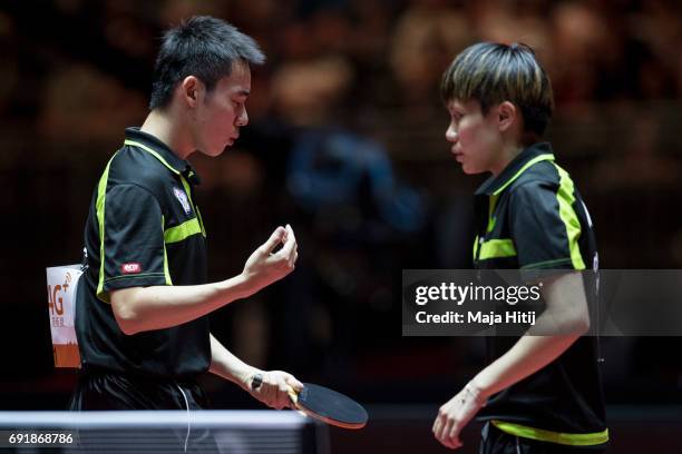 Taiwan's Chien-An Chen and I-Ching Cheng react during Mixed Doubles Finals at Table Tennis World Championship at Messe Duesseldorf on June 3, 2017 in...