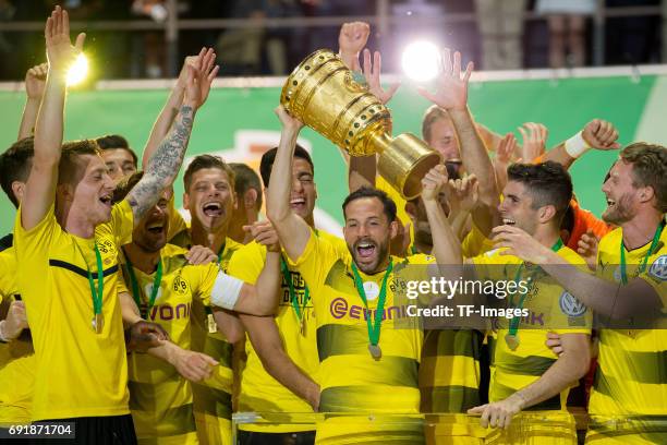 Gonzalo Castro of Dortmund celebrates with the trophy after winning the DFB Cup final match between Eintracht Frankfurt and Borussia Dortmund at...