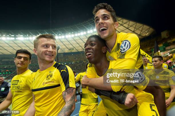 Marco Reus of Dortmund , Ousmane Dembele of Dortmund and Marc Bartra of Dortmund celebrates after winning the DFB Cup final match between Eintracht...