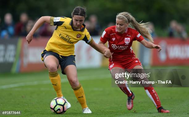 Lottie Wubbon-Moy of Arsenal Ladies is tackled by Olivia Fergusson of Bristol City Women during the WSL 1 match between Bristol City Women and...