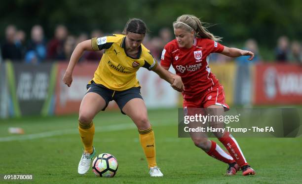 Lottie Wubbon-Moy of Arsenal Ladies is tackled by Olivia Fergusson of Bristol City Women during the WSL 1 match between Bristol City Women and...