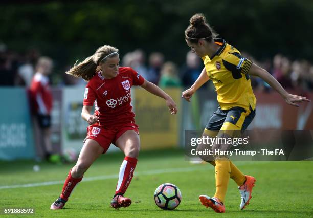 Dominique Janssen of Arsenal Ladies is tackled by Olivia Fergusson of Bristol City Women during the WSL 1 match between Bristol City Women and...