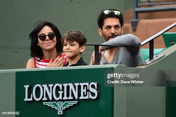 French actor Tomer Sisley with his partner Sandra Zeitoun de Matteis during day 7 of the French Open at Roland Garros on June 3, 2017 in Paris,...