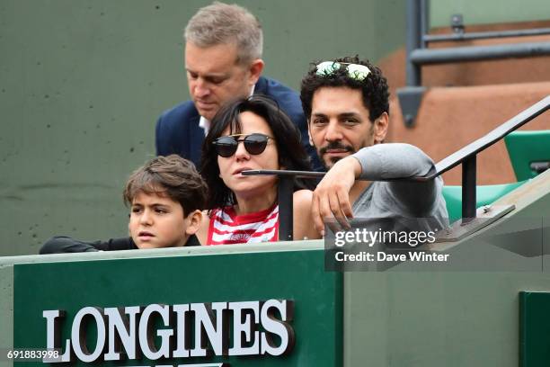 French actor Tomer Sisley with his partner Sandra Zeitoun de Matteis during day 7 of the French Open at Roland Garros on June 3, 2017 in Paris,...