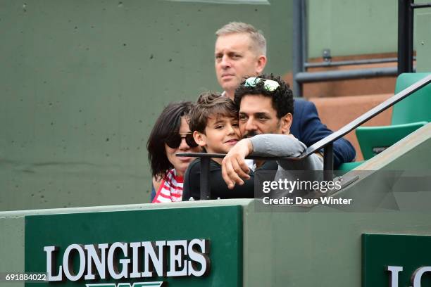 French actor Tomer Sisley with his partner Sandra Zeitoun de Matteis during day 7 of the French Open at Roland Garros on June 3, 2017 in Paris,...