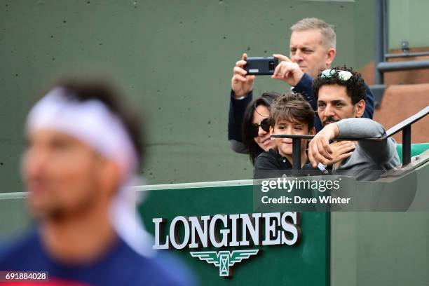 French actor Tomer Sisley with his partner Sandra Zeitoun de Matteis during day 7 of the French Open at Roland Garros on June 3, 2017 in Paris,...