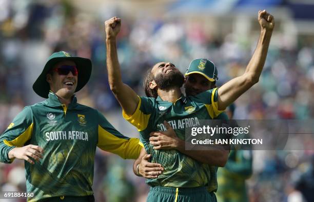 South Africas Imran Tahir celebrates with teammates taking the wicket of Sri Lankas Asela Gunaratne for four runs during the ICC Champions Trophy...