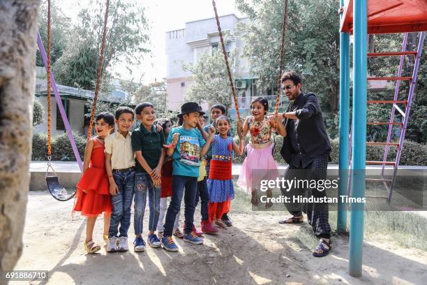 Bollywood actor Irrfan Khan posing with kids during an exclusive shoot for Hindustan Times' "Paathshala", an initiative that supports and funds the...