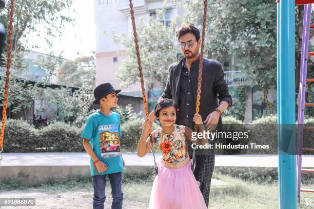 Bollywood actor Irrfan Khan posing with kids during an exclusive shoot for Hindustan Times' "Paathshala", an initiative that supports and funds the...