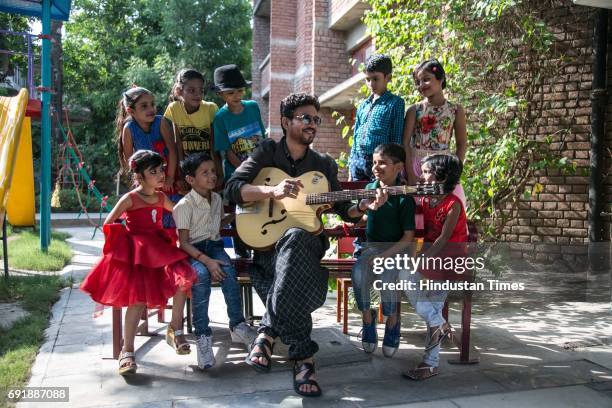 Bollywood actor Irrfan Khan posing with kids during an exclusive shoot for Hindustan Times' "Paathshala", an initiative that supports and funds the...