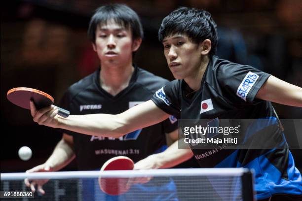 Koki Niwa of Japan and Maharu Yoshimura of Japan in action during Men's Doubles Semi-Finals at Table Tennis World Championship at Messe Duesseldorf...