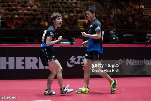 Masataka Morizono of Japan and Yuya Oshima of Japan celebrate during Men's Doubles Semi-Finals at Table Tennis World Championship at Messe...