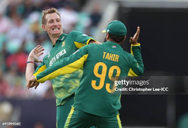 Morne Morkel and Imran Tahir of South Africa celebrate taking the wicket of Suranga Lakmal of Sri Lanka during the ICC Champions Trophy Group B match...