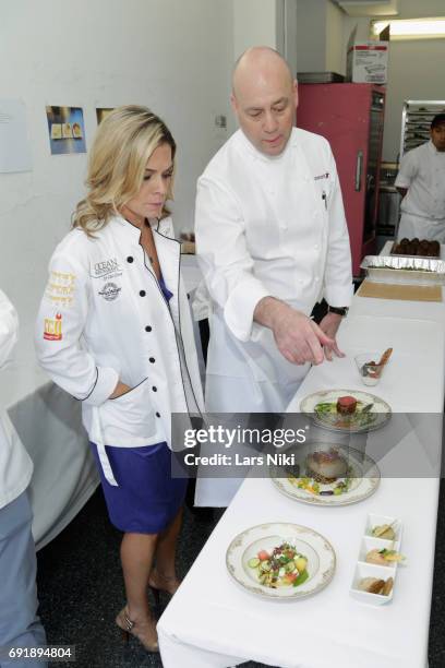 Chef Cat Cora prepares food at the Celebrity Chef Cat Cora Celebrates the In-Home Release of BEAUTY AND THE BEAST event With a Special Brunch and...