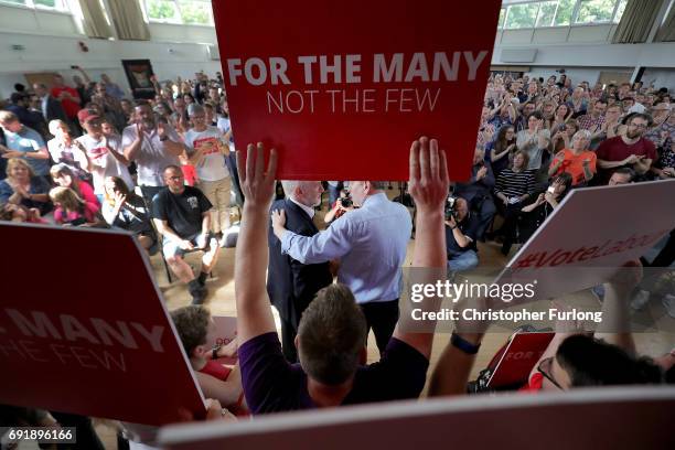 Labour leader Jeremy Corbyn is embraced by labour candidate Greg Marshall as he addresses a rally of supporters at Beeston Youth and Community Centre...