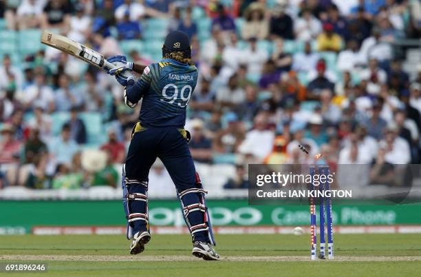 Sri Lankas Lasith Malinga is bowled by South Africas Kagiso Rabada for one run during the ICC Champions Trophy match between South Africa and Sri...