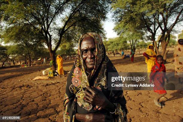 Sudanese internally displaced civilians newly arrived to Zam Zam camp wait for a food distribution outside of El Fasher, in North Darfur, October 19,...