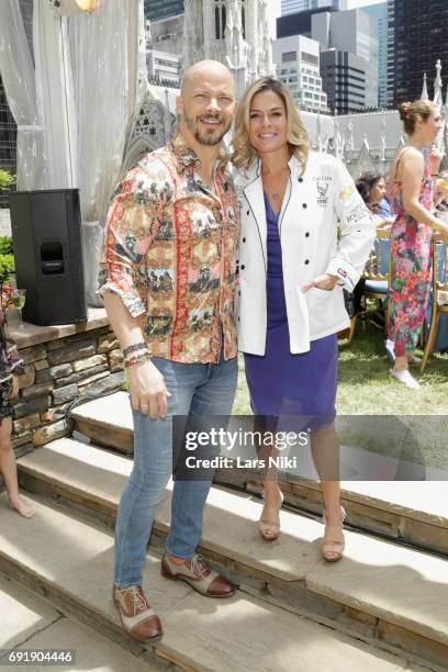 Berto Colon and Chef Cat Cora attend the Beauty and the Beast film at the Celebrity Chef Cat Cora Celebrates the In-Home Release of BEAUTY AND THE...