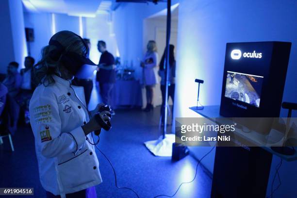 Chef Cat Cora uses Oculus VR at the Beauty and the Beast film at the Celebrity Chef Cat Cora Celebrates the In-Home Release of BEAUTY AND THE BEAST...