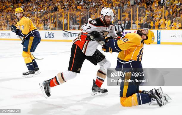 Ryan Kesler of the Anaheim Ducks cross checks Vernon Fiddler of the Nashville Predators in the mouth in Game Six of the Western Conference Final...