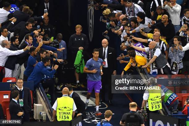 Real Madrid's Portuguese striker Cristiano Ronaldo enters the pitch prior to the UEFA Champions League final football match between Juventus and Real...