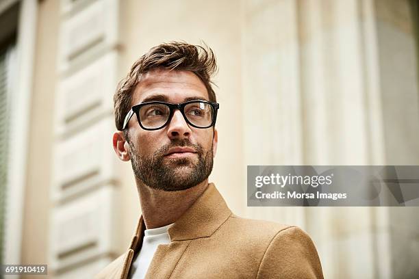 thoughtful confident businessman looking away - spectacles man stock pictures, royalty-free photos & images